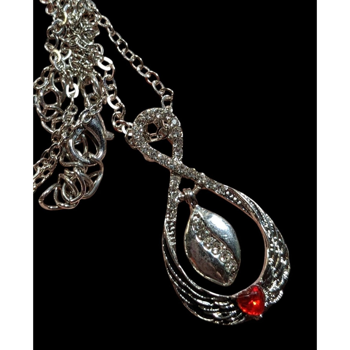 Heart And Wing Silver Tone Pendant Necklace With Clear And Red Gems