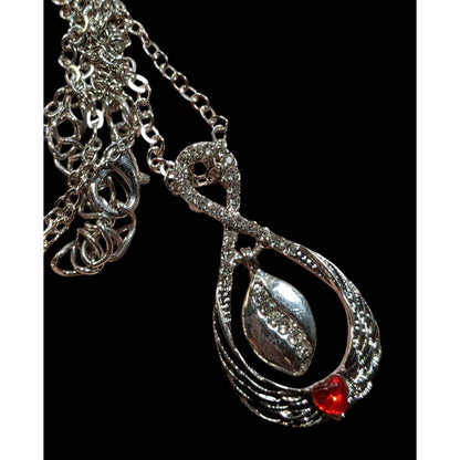 Heart And Wing Silver Tone Pendant Necklace With Clear And Red Gems