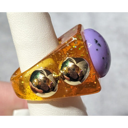 Chunky Translucent Orange Glitter Ring With Gold And Purple Accents