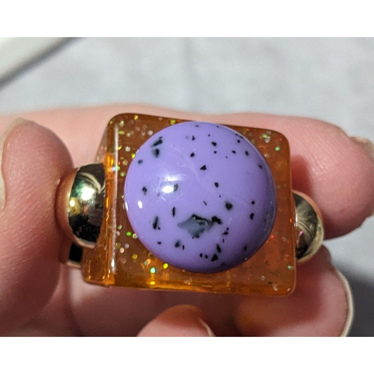 Chunky Translucent Orange Glitter Ring With Gold And Purple Accents