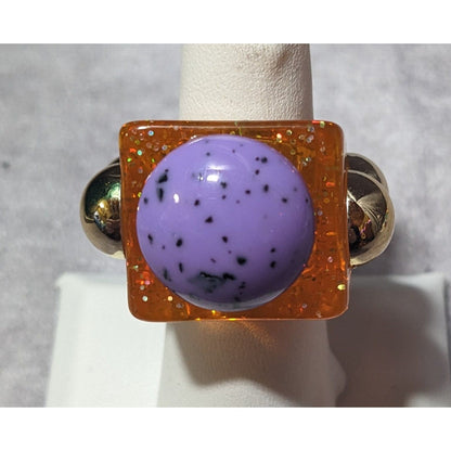 Chunky Translucent Orange Glitter Ring With Gold And Purple Accents