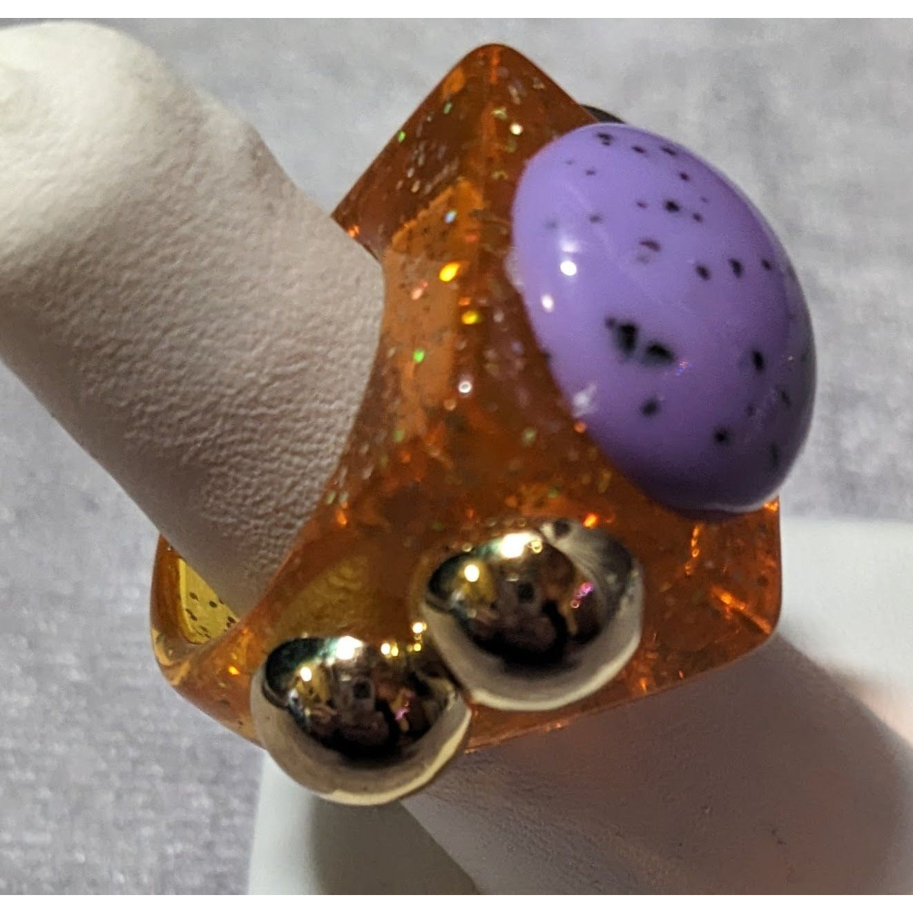 Chunky Translucent Orange Glitter Ring With Gold And Purple Accents