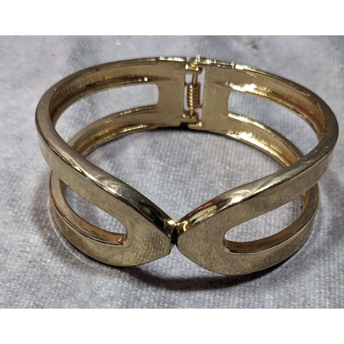 Gold-Tone Hinged Bangle Bracelet With Openwork Design