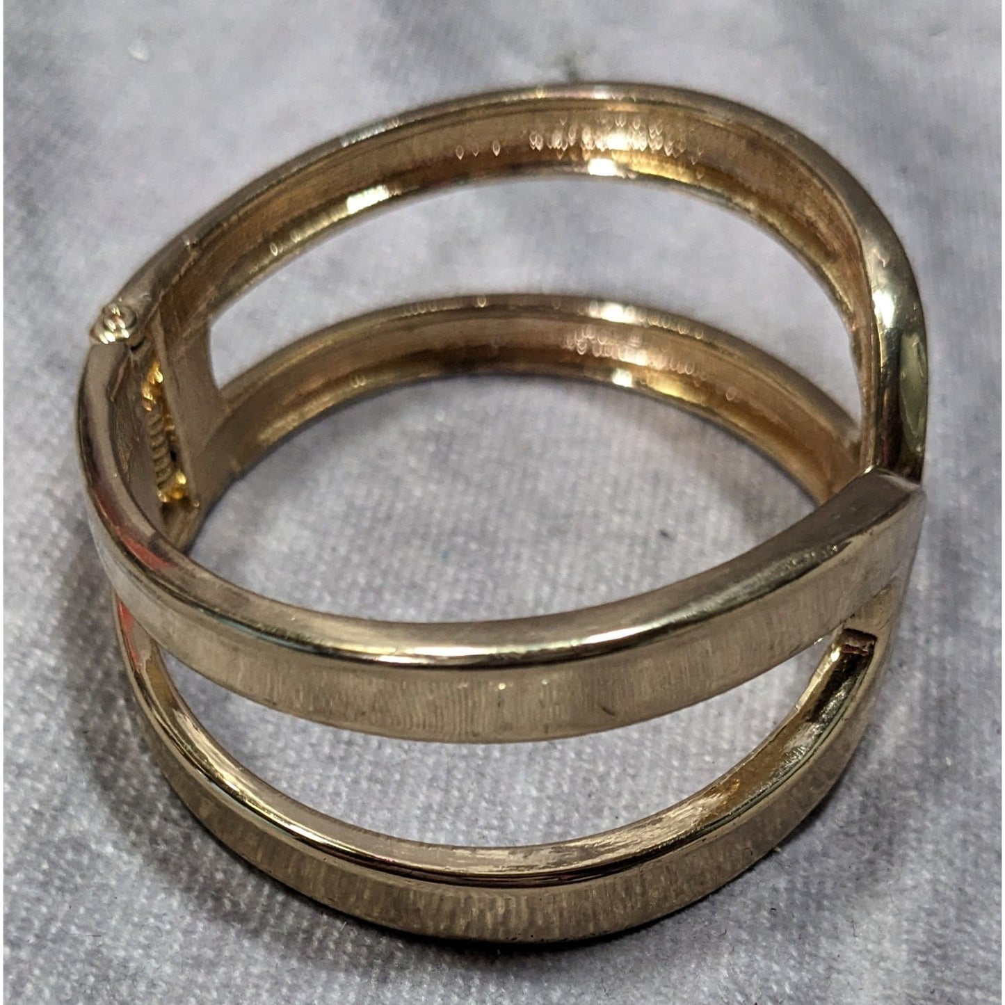 Gold-Tone Hinged Bangle Bracelet With Openwork Design