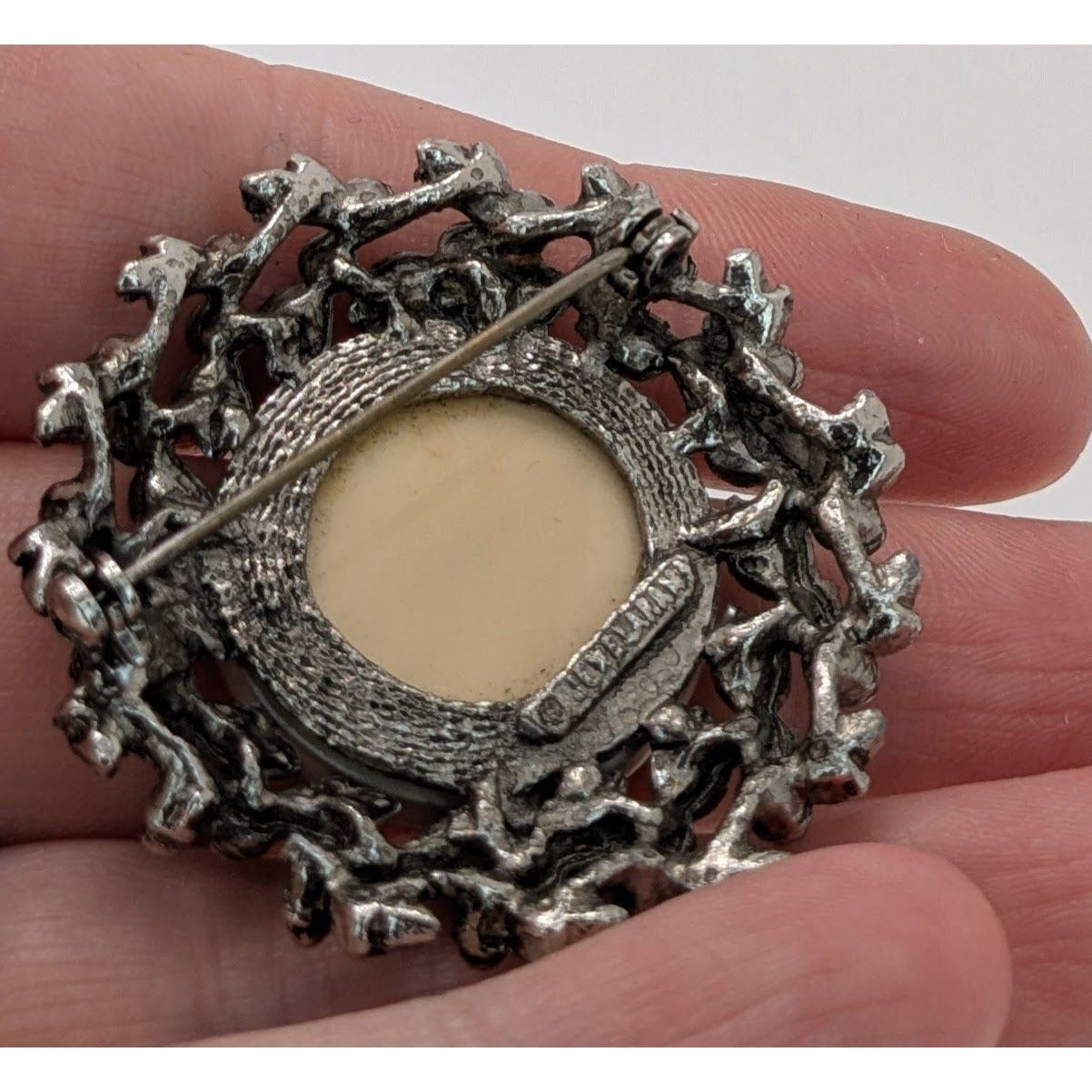 Vintage Prismatic Wreath Brooch With Iridescent Glass Centerpiece & Ornate Silver-Tone Floral Design