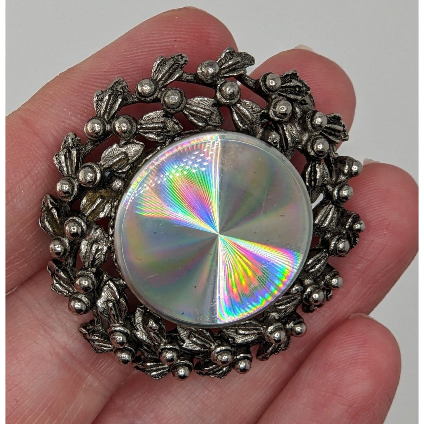Vintage Prismatic Wreath Brooch With Iridescent Glass Centerpiece & Ornate Silver-Tone Floral Design