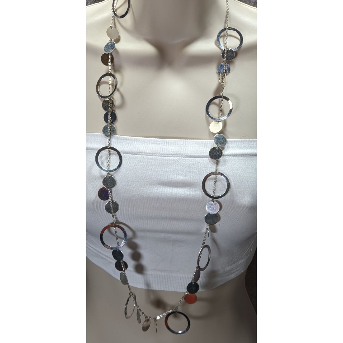 Vintage Glam Silver Tone Disc And Charm Necklace On Opera Length Chain