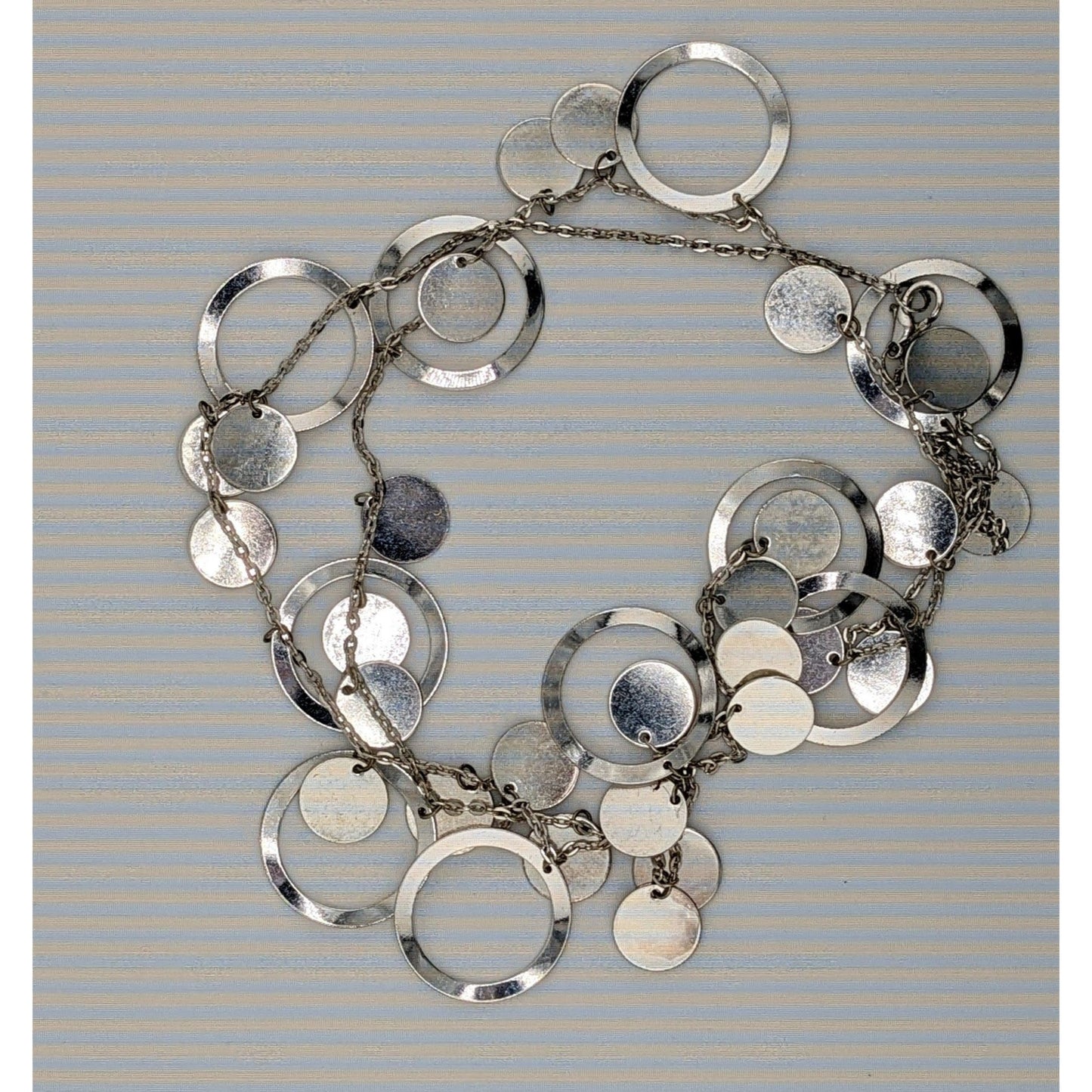 Vintage Glam Silver Tone Disc And Charm Necklace On Opera Length Chain