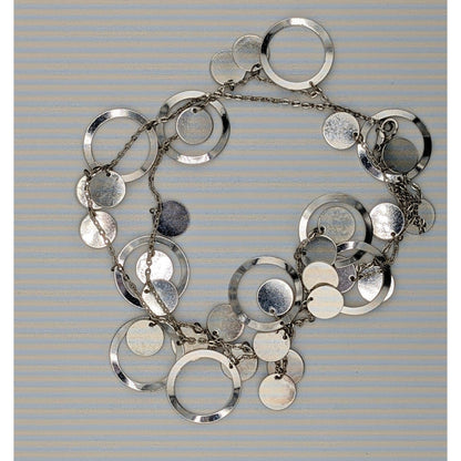 Vintage Glam Silver Tone Disc And Charm Necklace On Opera Length Chain