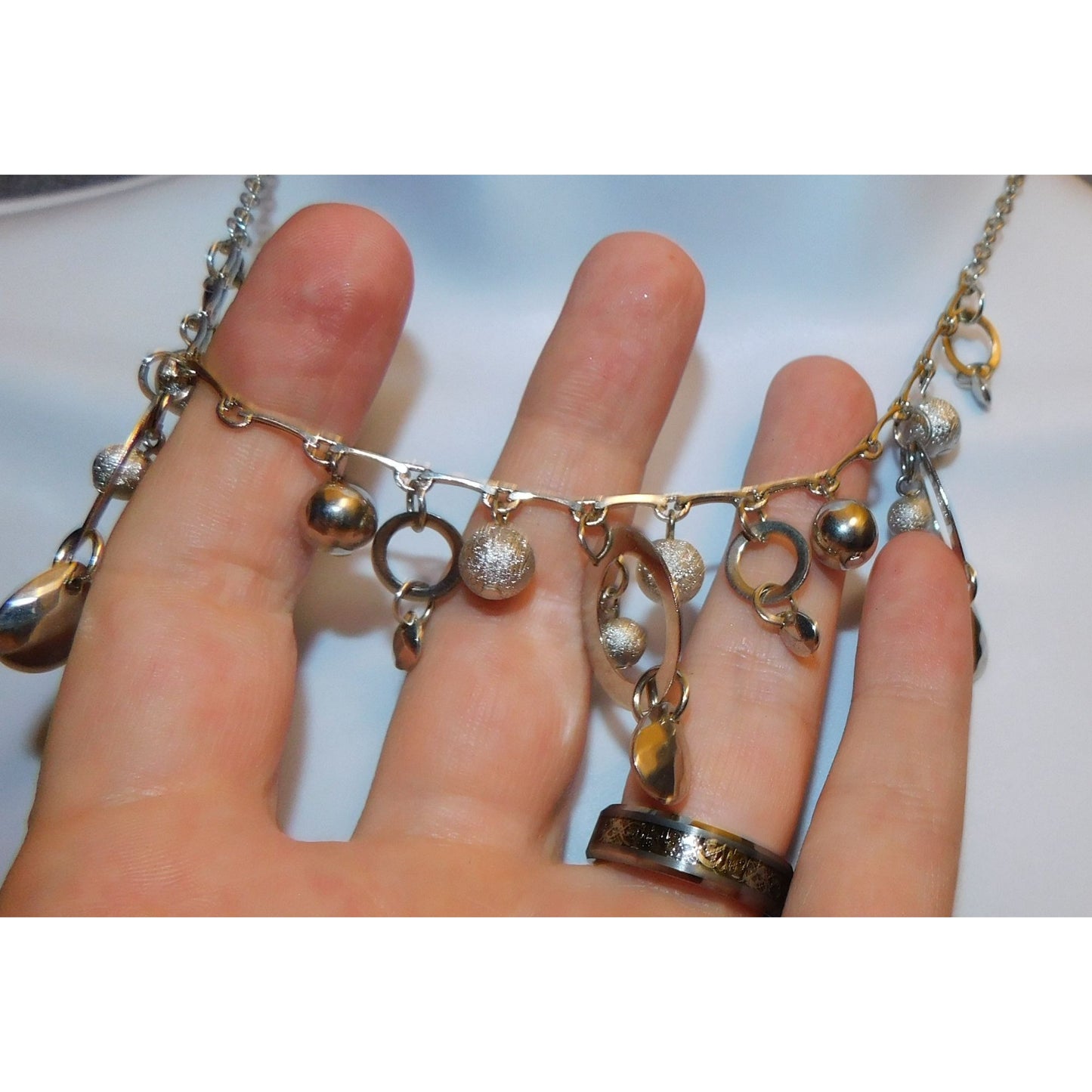 Whimsical Hoop And Charm Silver Tone Necklace