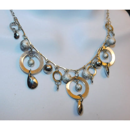 Whimsical Hoop And Charm Silver Tone Necklace