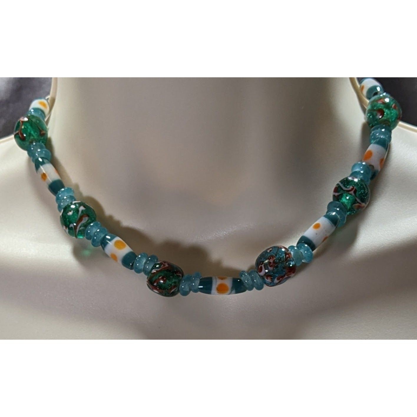Handcrafted Blue Glass Beaded Necklace With Swirled Green And White Accents