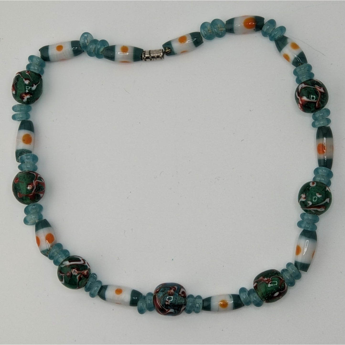 Handcrafted Blue Glass Beaded Necklace With Swirled Green And White Accents