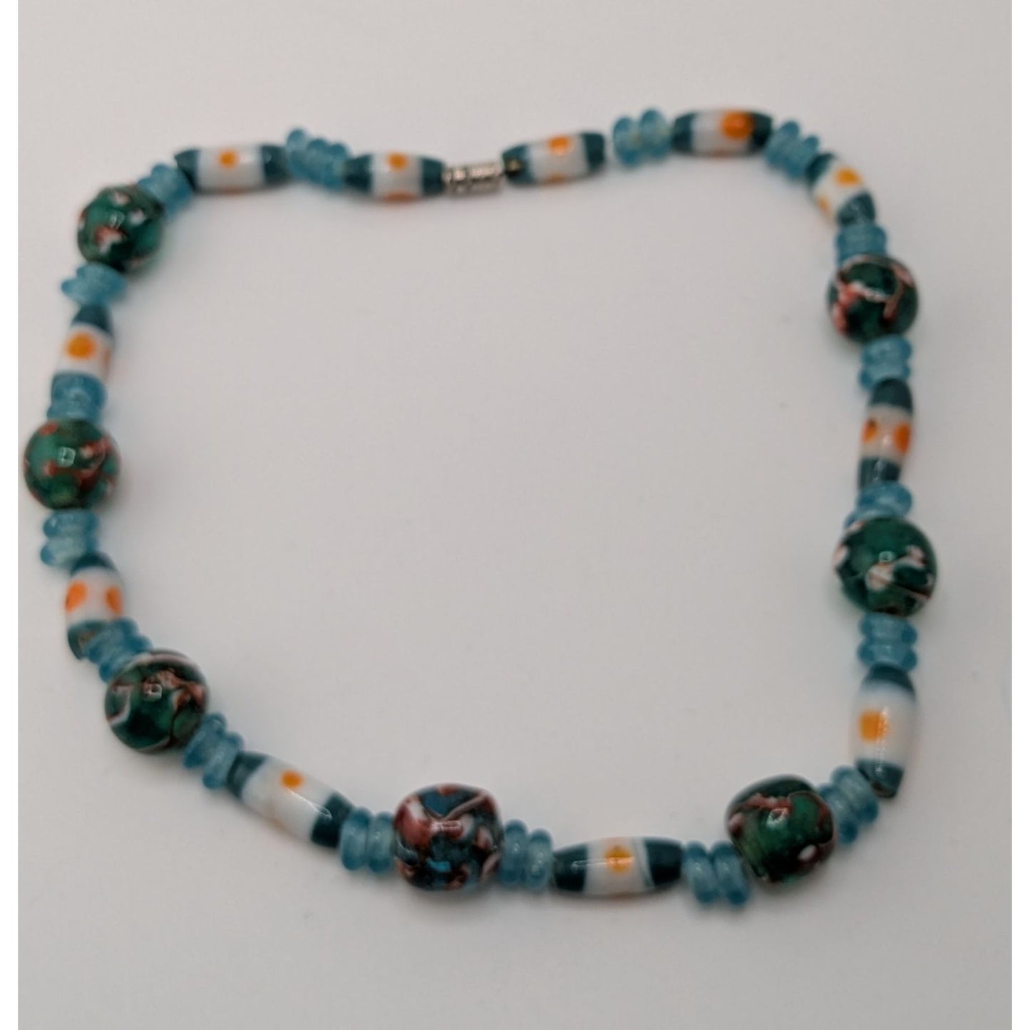 Handcrafted Blue Glass Beaded Necklace With Swirled Green And White Accents