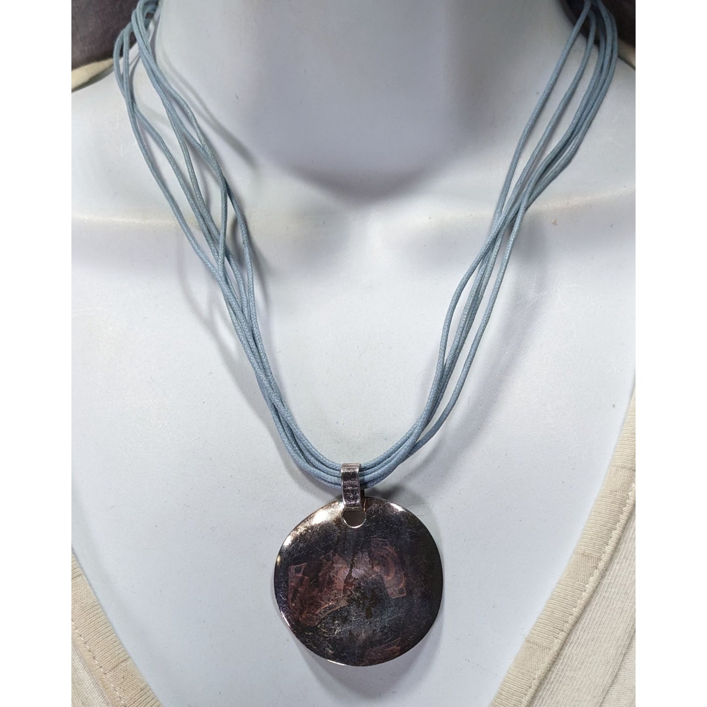 Distressed Casual Round Pendant Necklace With Multi-Strand Light Blue Cord