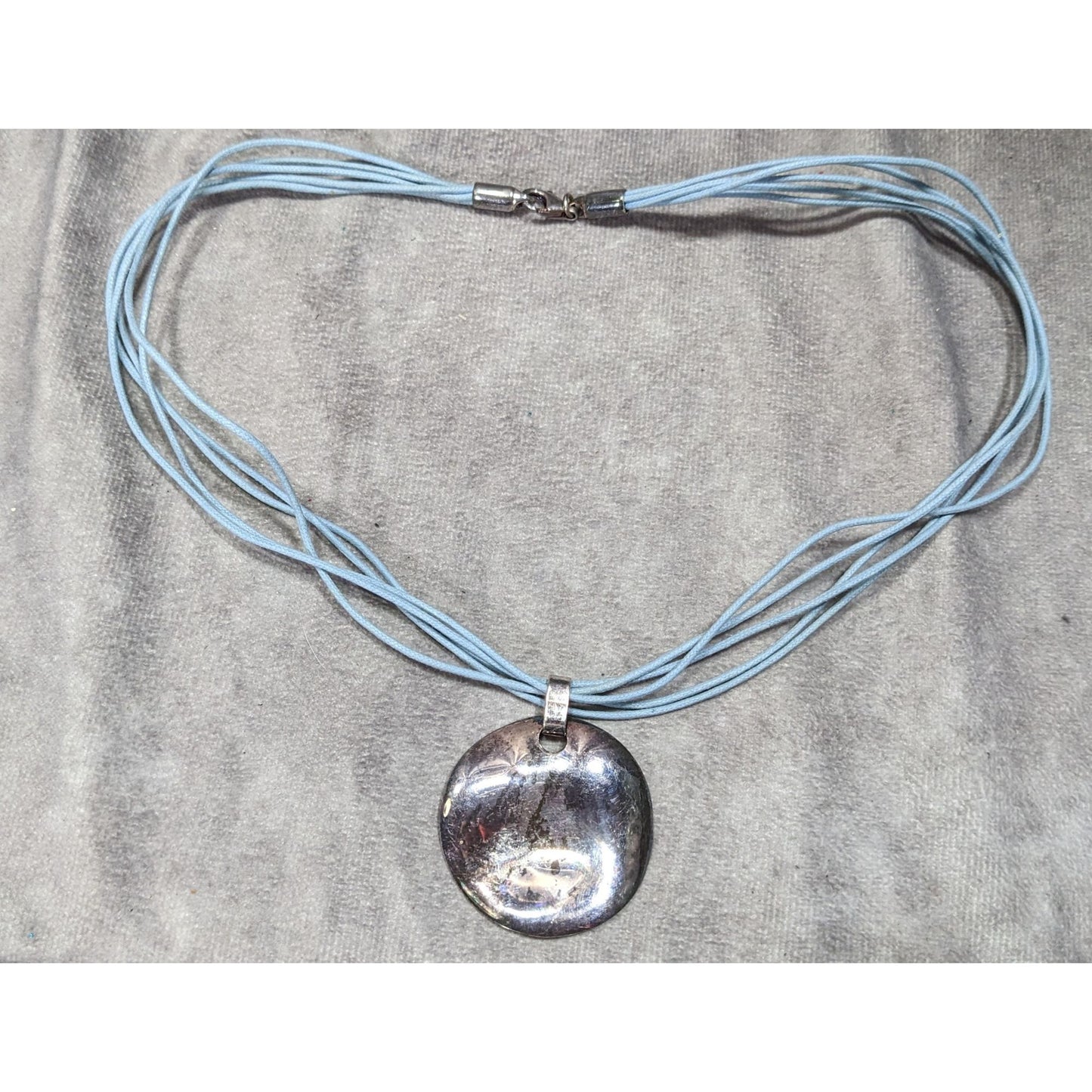 Distressed Casual Round Pendant Necklace With Multi-Strand Light Blue Cord