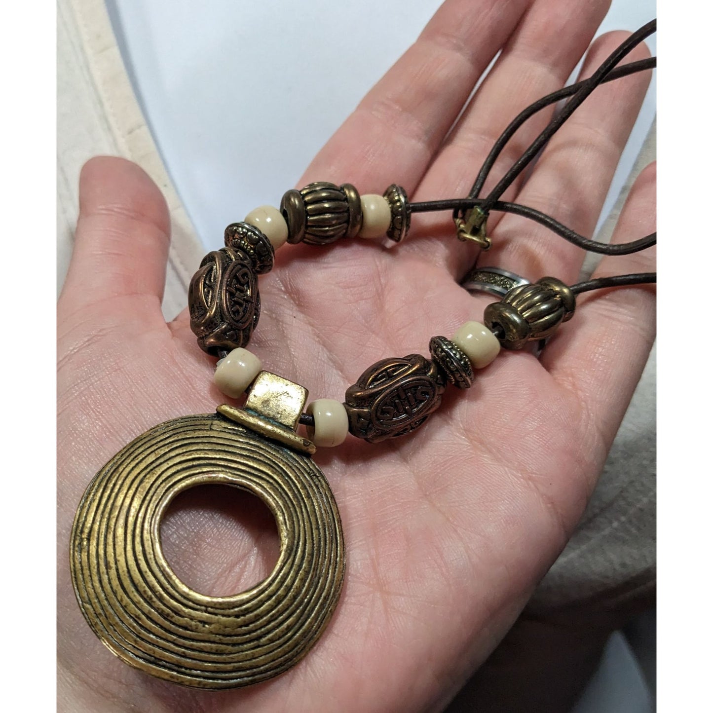Vintage Brutalist Gold Tone And White Beaded Medallion Pendant Necklace